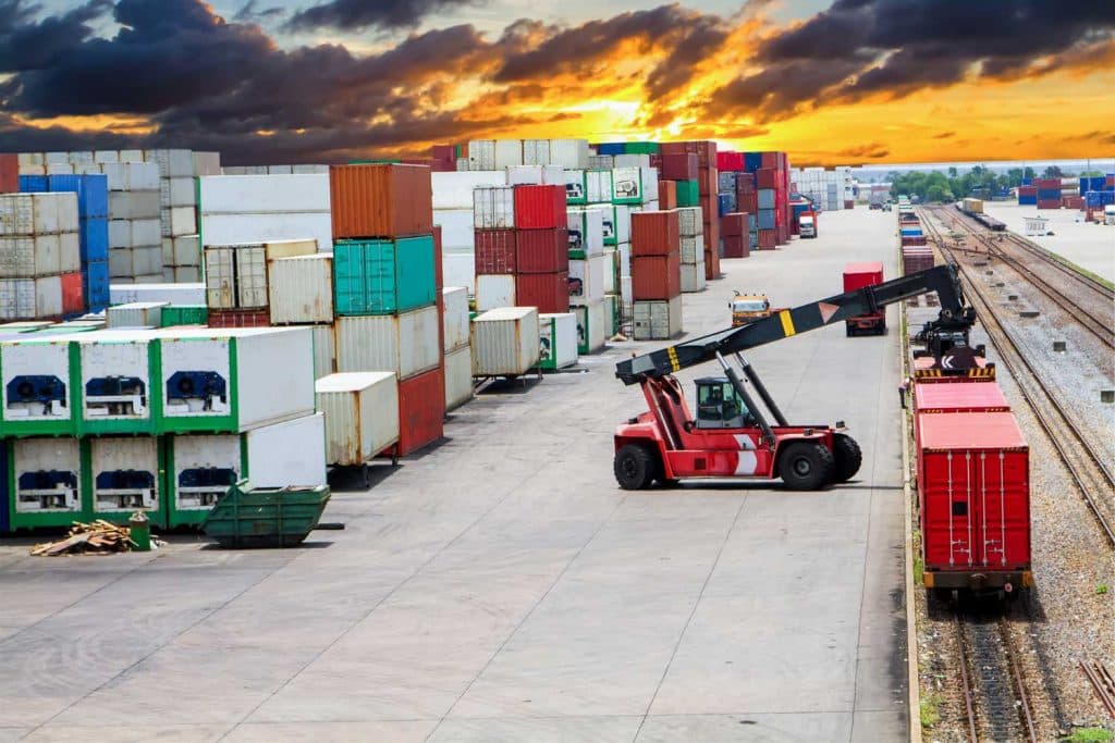 Yellow freight train on tracks