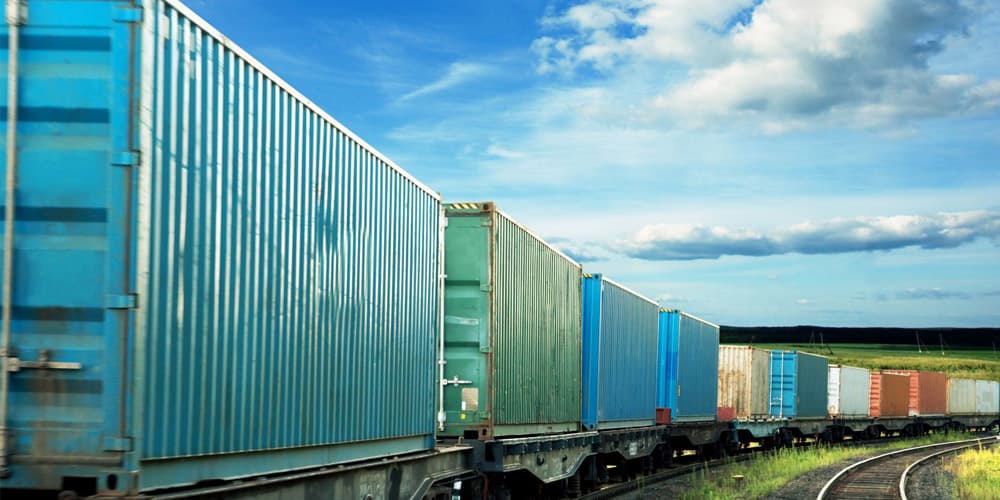 Yellow freight train on tracks